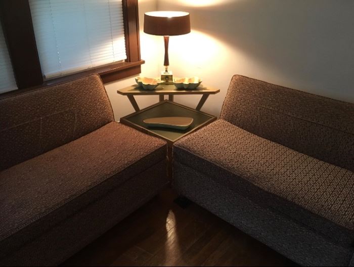 Mid century couch, corner table, and lamp.