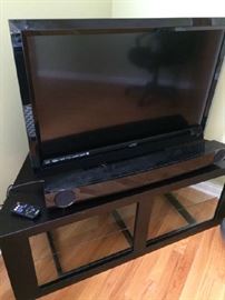 Flat screen TV, yamaha sound bar with remote, TV stand