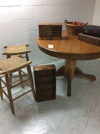 counter stools, soda case, radio, round table