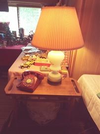 OLD DIAL PHONE & LAMP W/TOYS IN BACKGROUND