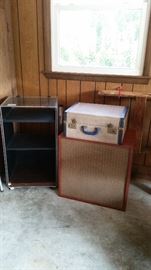 Wooden stereo speaker with wire, phonograph player (SOLD), glass stereo component storage cabinet with wheels
