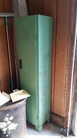 Vintage metal storage cabinet with wooden knob