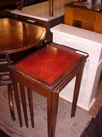 Mahogany leather top nesting tables.