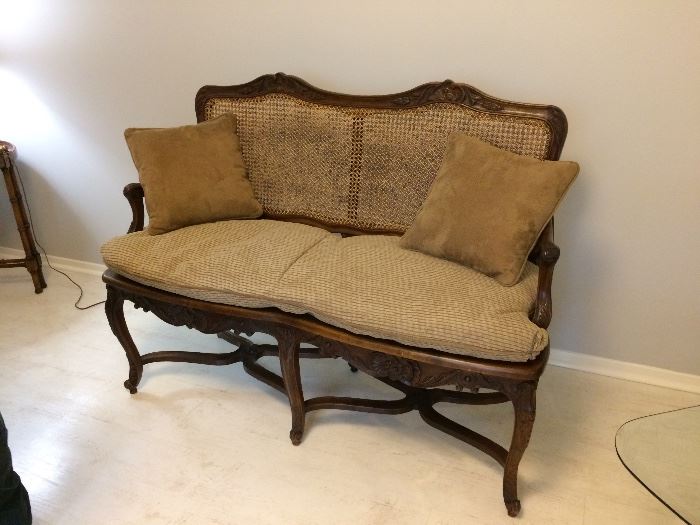  anitique handcraved settee wood with cane back and seat see the next few pictures for better viewing