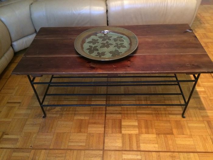 wooden top coffee table     large round pottery piece 