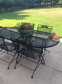 Outdoor iron table and chairs. Plants available too