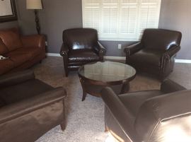 Set of 4 brown leather chairs and round coffee table
