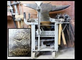A very large Ajax anvil on rolling stand with post vise
