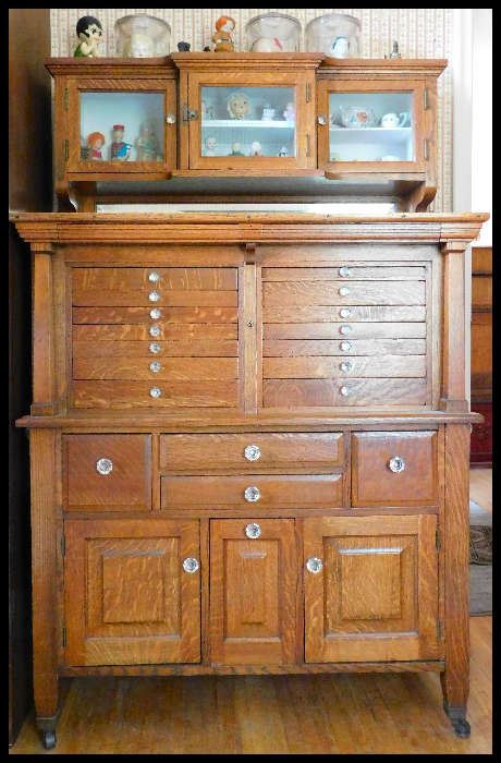  Beautiful oak dental cabinet with glass knobs 41 inches wide by 18 inches deep by 63 inches tall