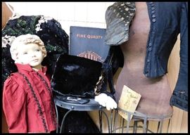 Child size vintage mannequin, fur muff, and antique clothing