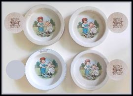 Four Campbell's soup bowls. Three are vintage marked by Buffalo Pottery. Fourth one is newer with no marks.