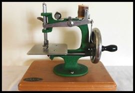 Grain miniature or toy sewing machine circa 1920s and 1930s. Made in England