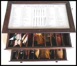 Interchangeable Needle List box with two drawers filled with needles and sewing notions