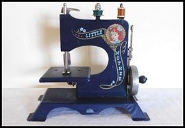 Miniature sewing machine called Little Mother manufactured by Artcraft Metal Products Inc. circa 1940s