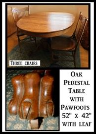 Oak oval pedestal table with leaf including three chairs