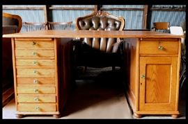 Partners' oak desk measuring 60" wide by 48" deep by 30" tall