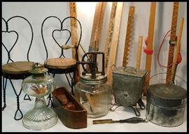 Sampling of antiques including miniature ice cream chairs, kerosene lamps, butter churn, hot hair comb, French fry machine, skirt measurers and more