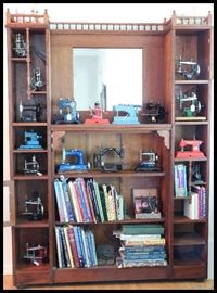 Spindled antique book case 40 inches wide by 18 inches deep by 80 inches tall. Also some books including books on antique collecting