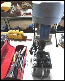 Tools including a five speed bench drill press