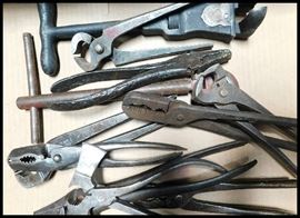 Tools including wrenches, wire cutters, pliers, and an antique Rasin wrench