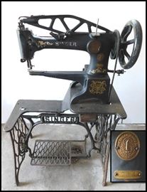 This is a Singer treadle cobbler's sewing machine. Model number 29-4