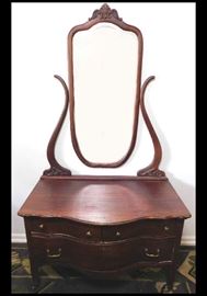 Mahogany serpentine dresser with mirror