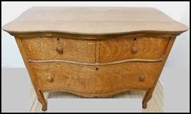 Oak serpentine chest of drawers