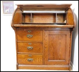 Oak desk with three drawers and a cupboard