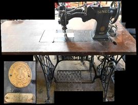 Double needle Singer heavy duty sewing machine. Model 72W19 on stand. Includes manual.