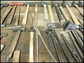 More blacksmith tools including flatters hammers, tongs , other hammers and more