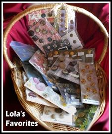 We believe these to be some of Lola's favorite buttons. They include vintage and newer metal, military, wooden, crystal, bakelite, bachelor, toggles, shanks, Goodyear rubber, jet black, nurse, glass shell, vegetable ivory, porcelain, acrylic, rhinestones, stone, and more!
