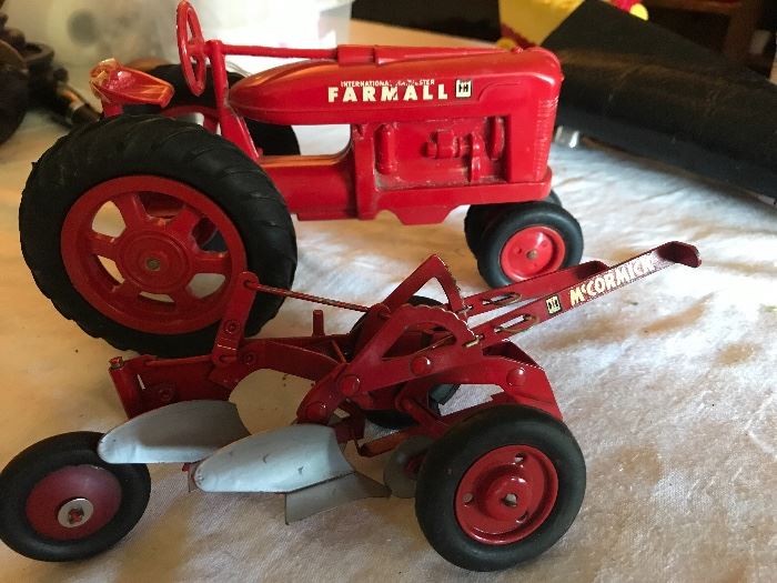 Farmall toy tractor and McCormick attachment 