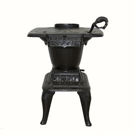 Antique Klein Cast Iron Laundry Stove: An antique cast iron laundry stove by the Klein Stove Company. This small stove has a flat top surface, a tapered body and a square belly with four cabriole legs. The upper door is marked “Laundry No 30”, the lower door is marked “SAM”, and the base is marked “Klein Stove Co. Phil’a PA”.