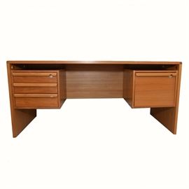 Vintage Danish Modern Teak Desk: A vintage Danish Modern teak desk. Features three floating drawers on the left, and a floating filing cabinet on the right, each with integrated modern pulls. Each side locks but keys are not provided.
