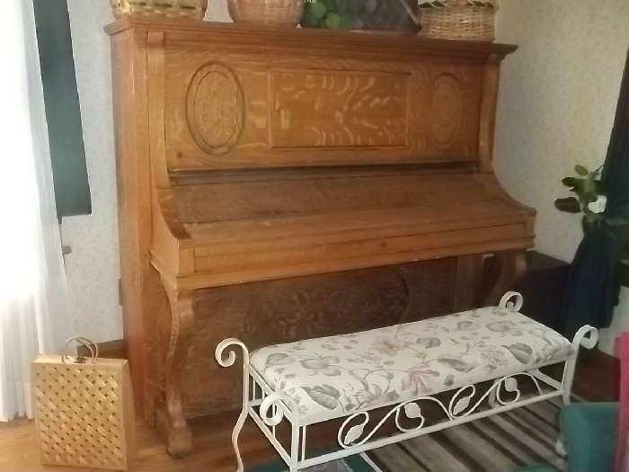 beautiful piano and iron bench