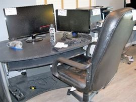 nice computer desk, chair and a couple of the monitors