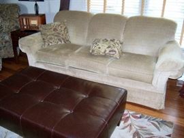 Sofa, ottoman, rug, Silvertone radio