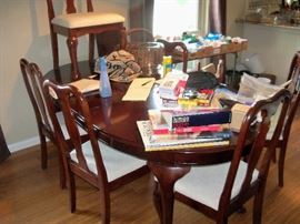 dining room table with chairs (I will try to put up a better picture, it is really heavy and nice.