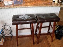 pair of bar stools, one button is broke, but I taped it to chair, priced accordingly