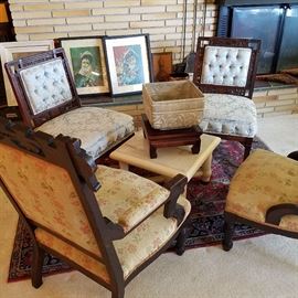 Victorian chairs, Oriental rug, Onyx top table.  Note: Back chairs with tufted backs appear to have rosewood frames.