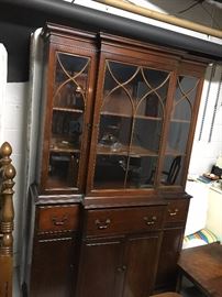 Intricate mahogany breakfront with hidden desk in front middle drawer; lots of places to display and store