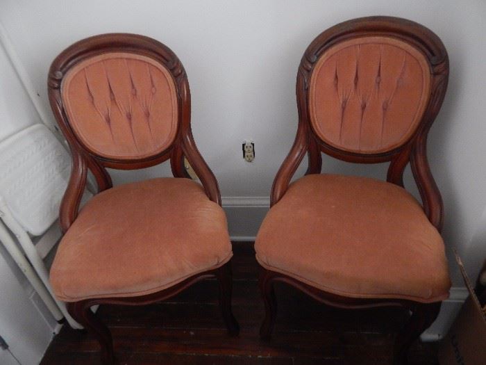 Pair of Victorian chairs with coral velvet fabric.