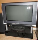 35" Sony Wega flat screen tv on black stand. Panosonic blue ray / dvd player, Samsung DVD Player