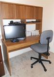 one of two computer desks. Flat screen monitor. One of two computer station chairs