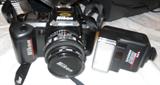 Nikon 35 mm film camera with 50mm Nikkor lens and flash unit