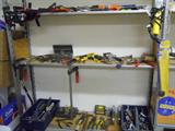 large collection of hand tools: screw drivers, wrenches, wratchets, vices, clamps, hand drills, saws