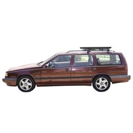 1994 Volvo 850 Turbo Wagon: A 1994 Volvo 850 Turbo Wagon. VIN is YV1LW571R2054754, and the car has 111,056 miles. The 4-door wagon is burgundy and features a 2.3 liter 5 cylinder gasoline engine and automatic transmission. The interior of the car features tan leatherette upholstery with burl wood trim to the dash. The vehicle is equipped with power locks, windows, and seats.