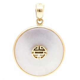 14K Yellow Gold White Jadeite Longevity Bi Pendant: A 14K yellow gold white jadeite bi disc pendant by Gump’s Jewelry. 
This piece features an open work Chinese longevity medallion (壽 shou) which is set to the center of a carved white jadeite bi disc.