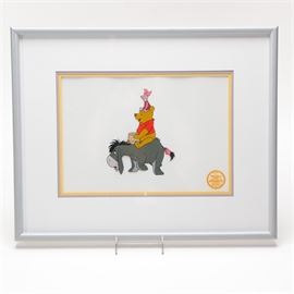 Walt Disney Serigraph Cell from "Winnie The Pooh and The Blustery Day": A Walt Disney Serigraph Cell. This piece depicts Winnie the Pooh riding on the back of Eeyore with Piglet on his head from the original movie art titled Winnie The Pooh and The Blustery Day. The serigraph uses thirteen colors and was limited to a total edition of 9,500. This piece bears the Walt Disney Company seal. It is presented in a light blue lacquer frame, under glass, with a triple mat, wire and print info is on the verso.