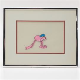 Original Animation Celluloid "The Pink Panther": An original animation celluloid from The Pink Panther. This cel feature the main character from the popular animated series bending over and wearing a blue sailors hat. Mounted under a double layer of red and white matting, the cel is presented under glass in a silver tone metal frame. A certificate from Gallery Lainzberg, a framer’s decal, and a decal about the cel are present to the verso of the frame.